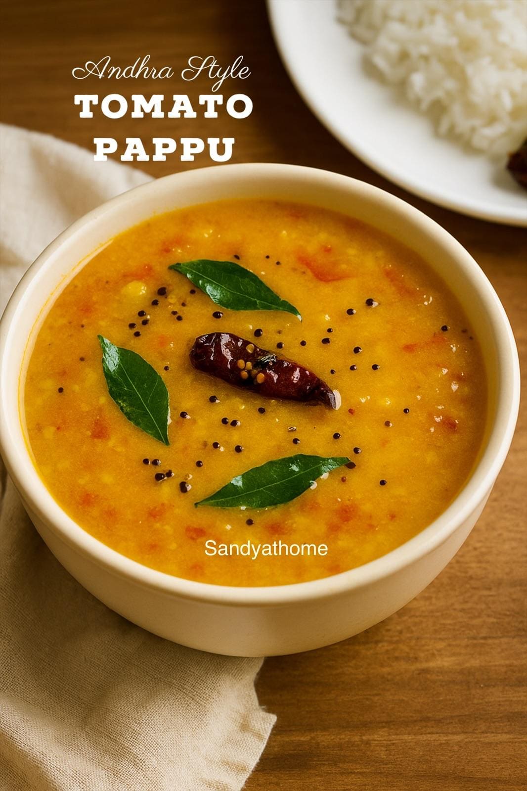 Traditional South Indian meal with tomato pappu, rice, ghee, and pickle on a banana leaf