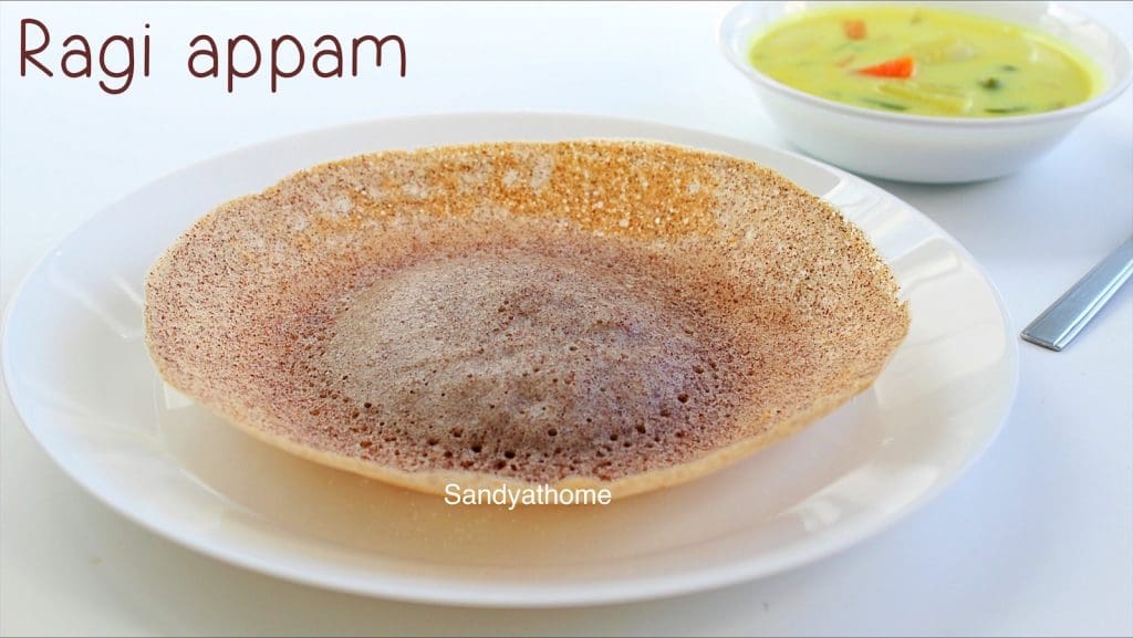 Close-up of ragi appam showing bowl shape and crispy golden edges with coconut milk side
