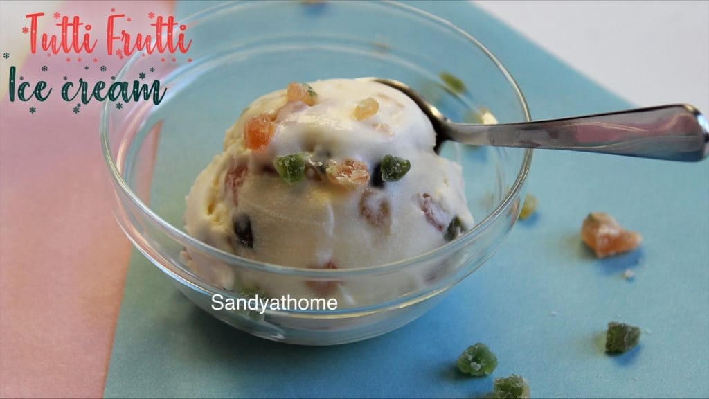 Vibrant and creamy tutti frutti ice cream with visible candied fruit pieces, ideal summer dessert.