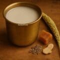 Homemade kodo millet milk served in a rustic glass, a traditional Indian dairy-free drink