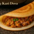 Crispy dosa stuffed with spicy soya kari, served on brass plate with chutney and sambar