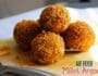 Crispy kodo millet arancini on a rustic plate