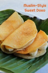 Folded maida sweet dosa with banana, served on banana leaf in Tamil Muslim style