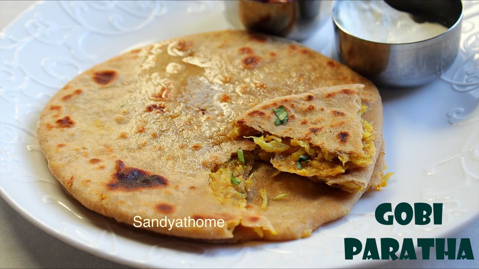 Gobi paratha recipe with cooked cauliflower stuffing, served hot on a plate