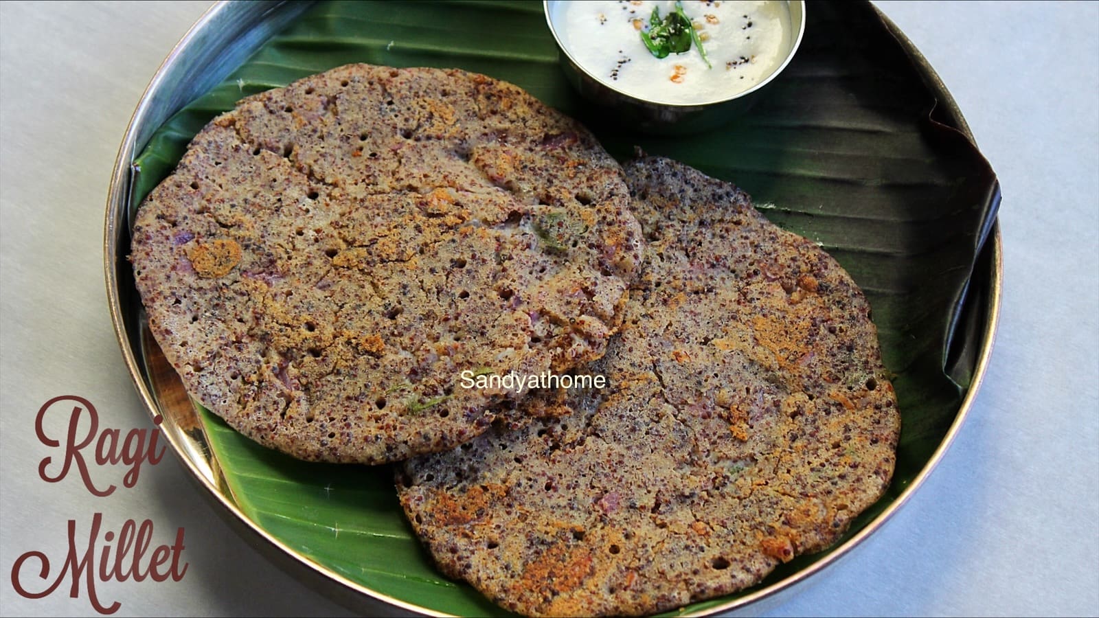 Golden-brown millet adai made with whole ragi and chana dal – healthy South Indian tiffin revived by Sandhya.