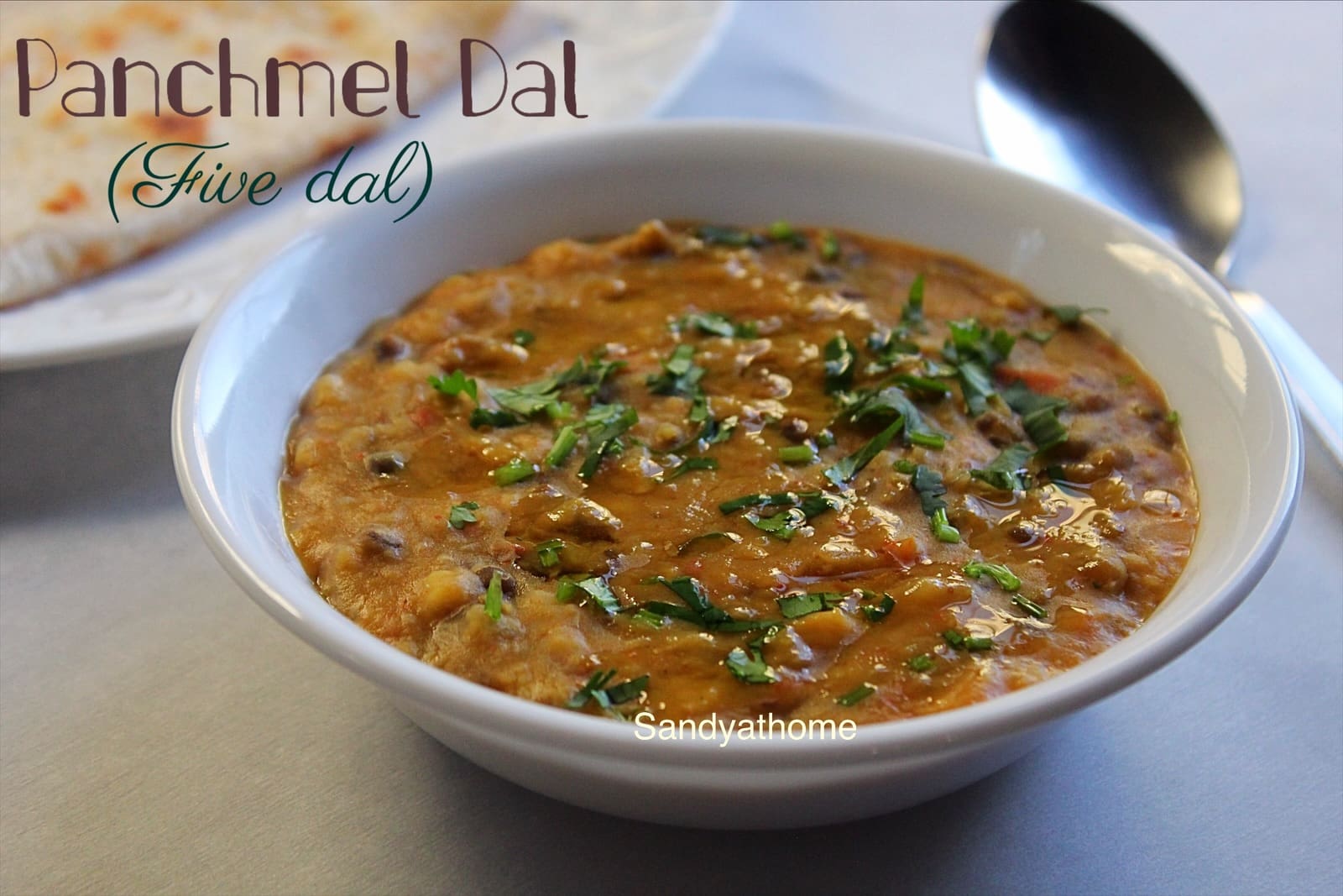 Panchmel Dal served in a brass bowl with rice — traditional Rajasthani 5 dal recipe with ghee tadka, onion, and garlic.