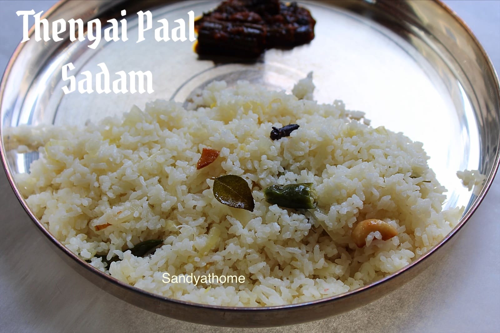Traditional rice dish Thengai Paal Sadam with soft onions, curry leaves, and spices