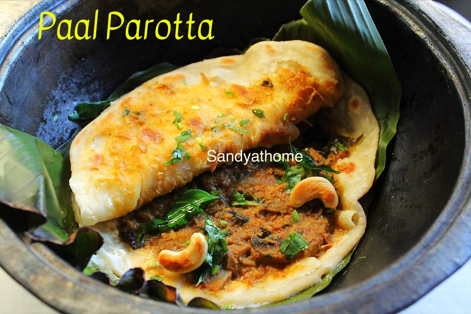 Parottas layered in banana leaf, soaked in coconut-rich mushroom salna.