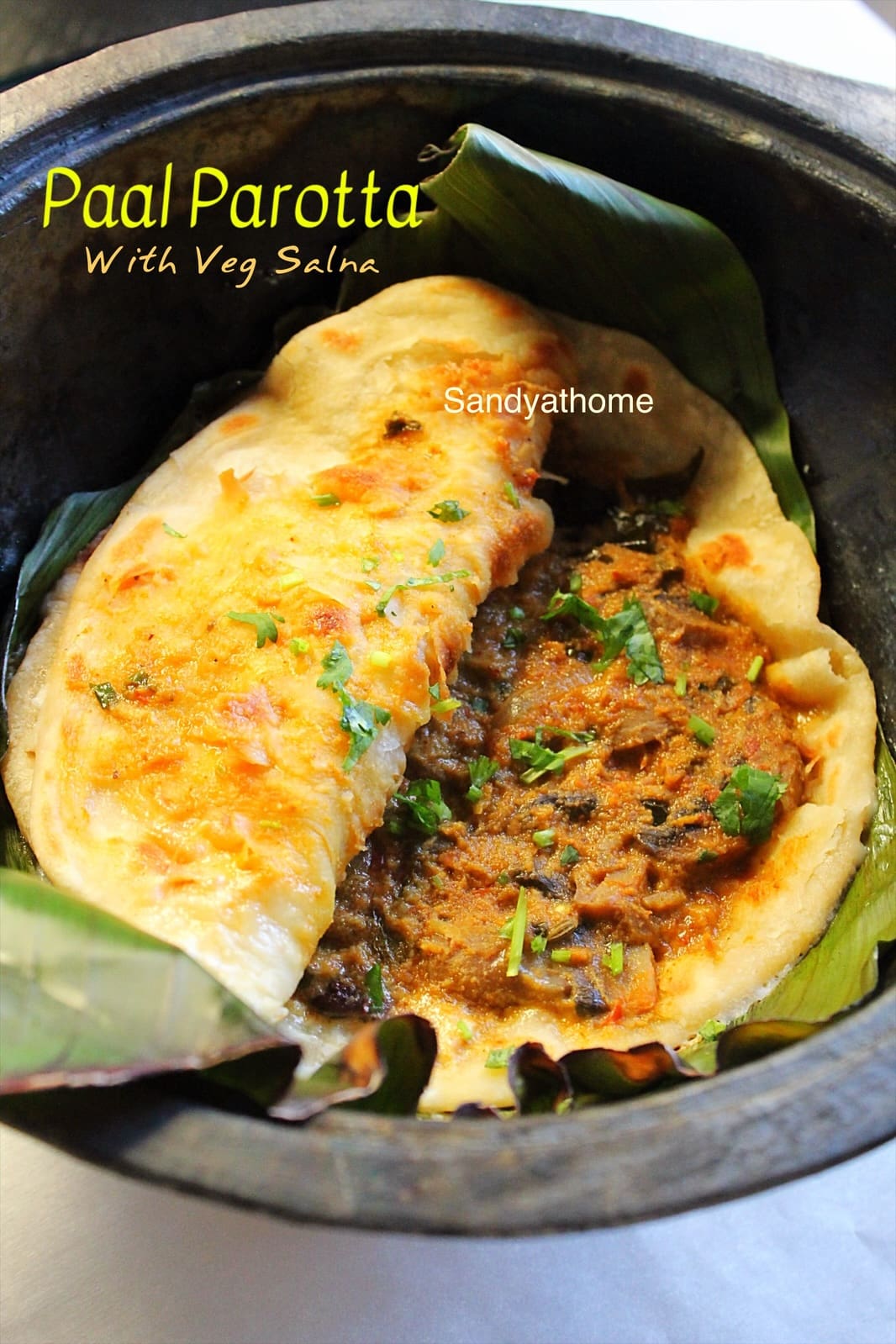 Flaky Kerala-style paal parotta served in banana leaf with creamy coconut salna.