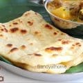 Flaky Ceylon parotta folded in square style, made with egg dough, served hot on a banana leaf – a Tamil street food classic.