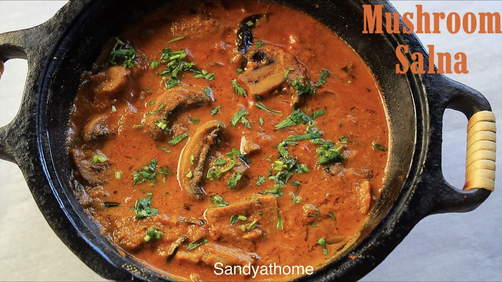 Vegan mushroom salna in coconut gravy served with parotta – South Indian vegetarian side dish.