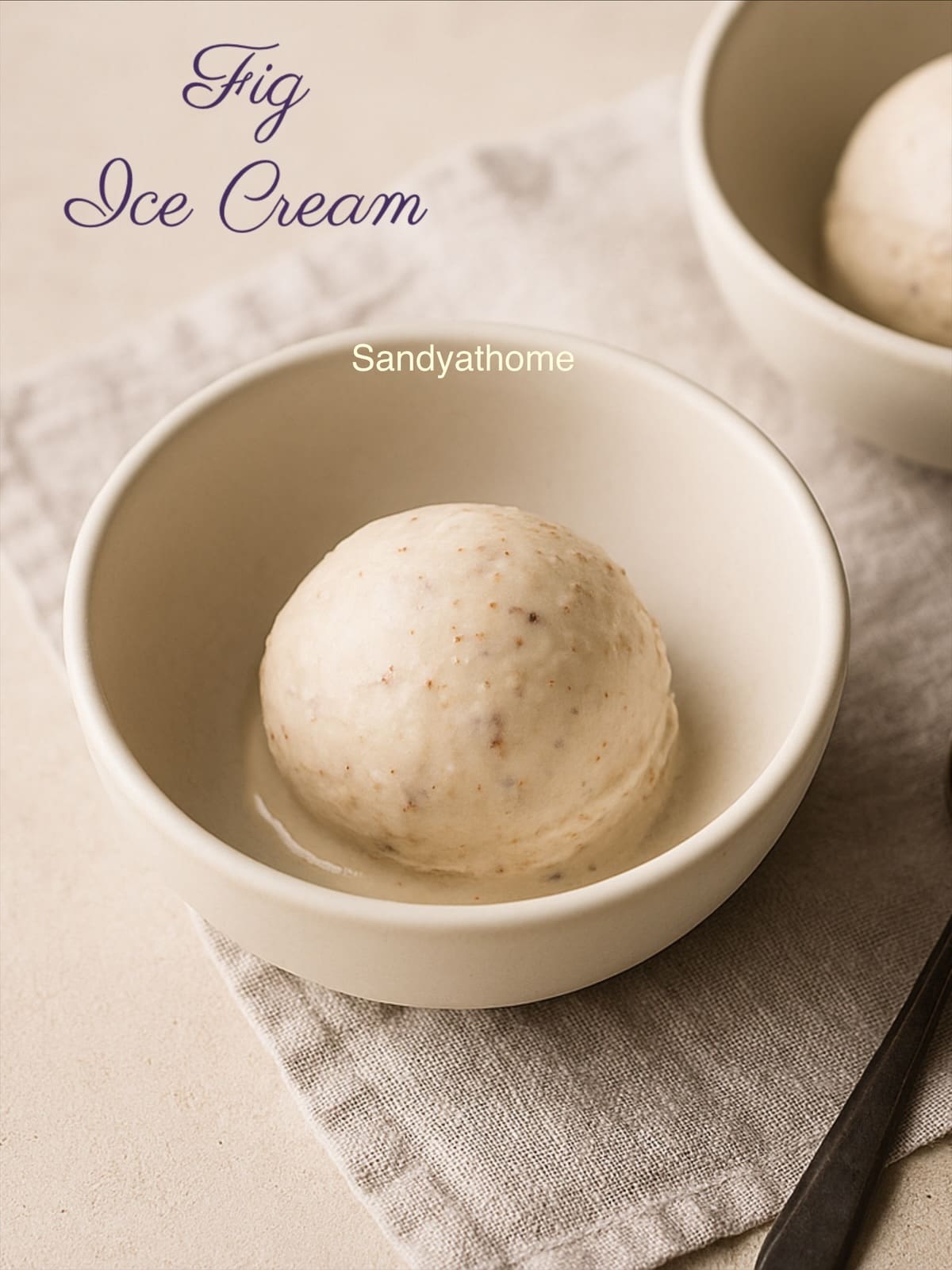 A creamy scoop of fresh fig ice cream served in a rustic ceramic bowl, highlighting its soft texture and pink fig hue — a no-churn, eggless, and naturally sweet summer dessert.