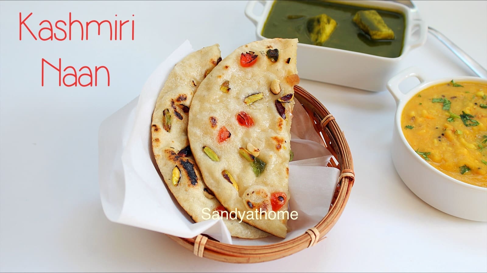 Festive Kashmiri naan decorated with dry fruits and raisins, brushed with saffron ghee for shine.