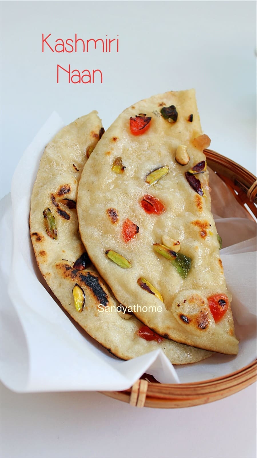 Step-by-step Kashmiri naan cooked on tawa with colorful nut and fruit toppings.
