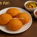 close-up of crispy puffed besan pooris with warm spices, Indian poori recipe