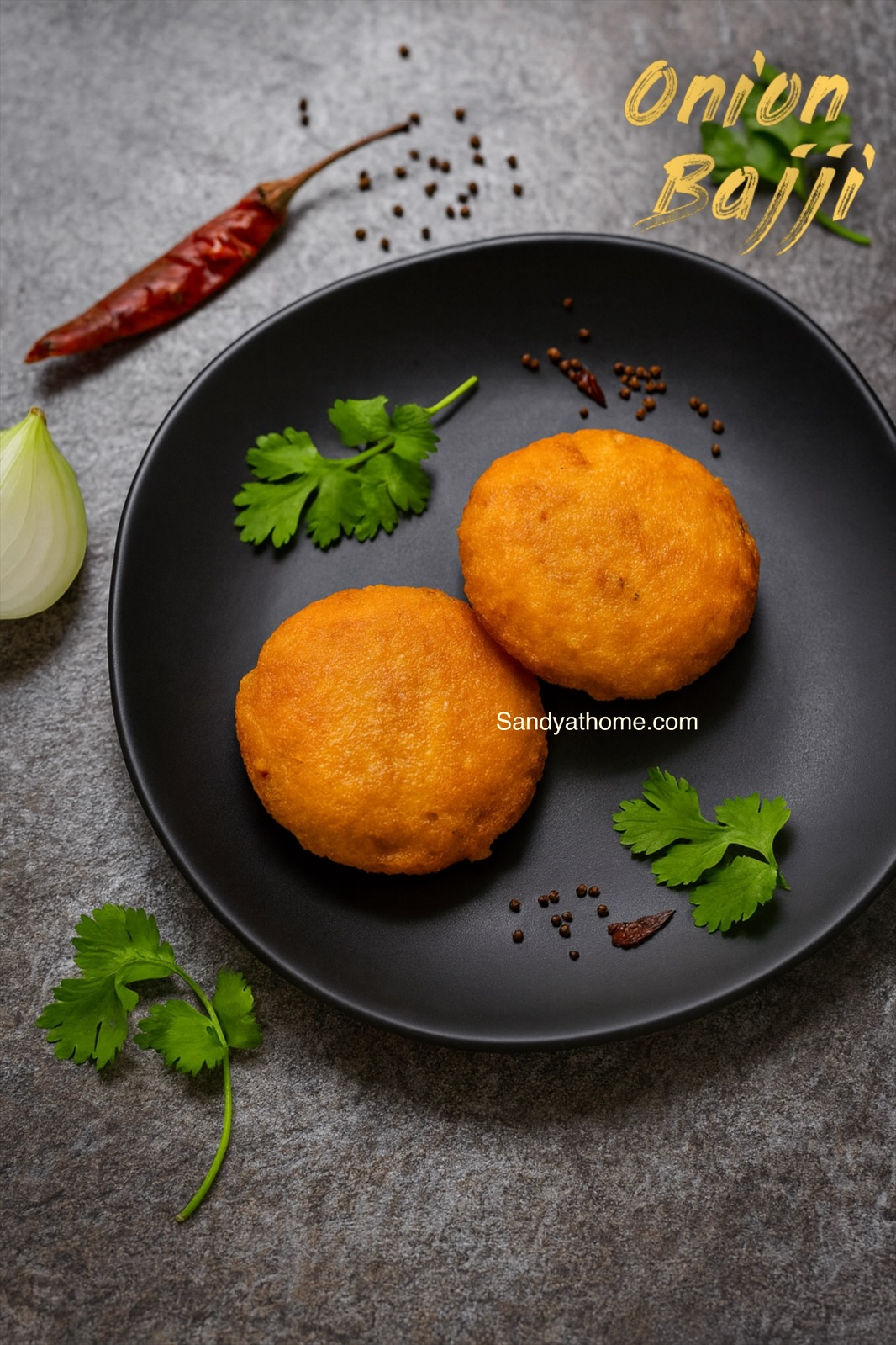 Crispy golden onion bajji served with coconut chutney on a banana leaf — South Indian tea-time snack.